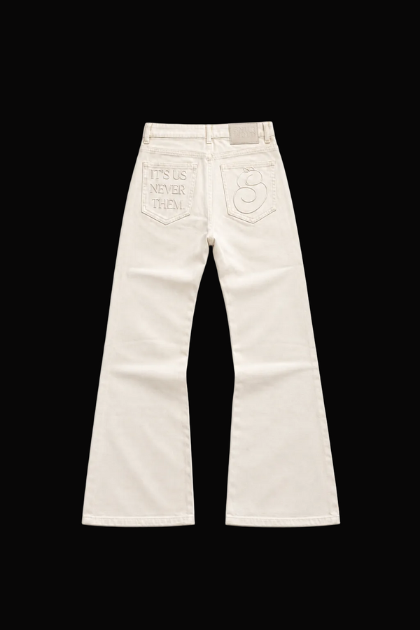 "ITS US, NEVER THEM" WAXED FLARED DENIM PANTS