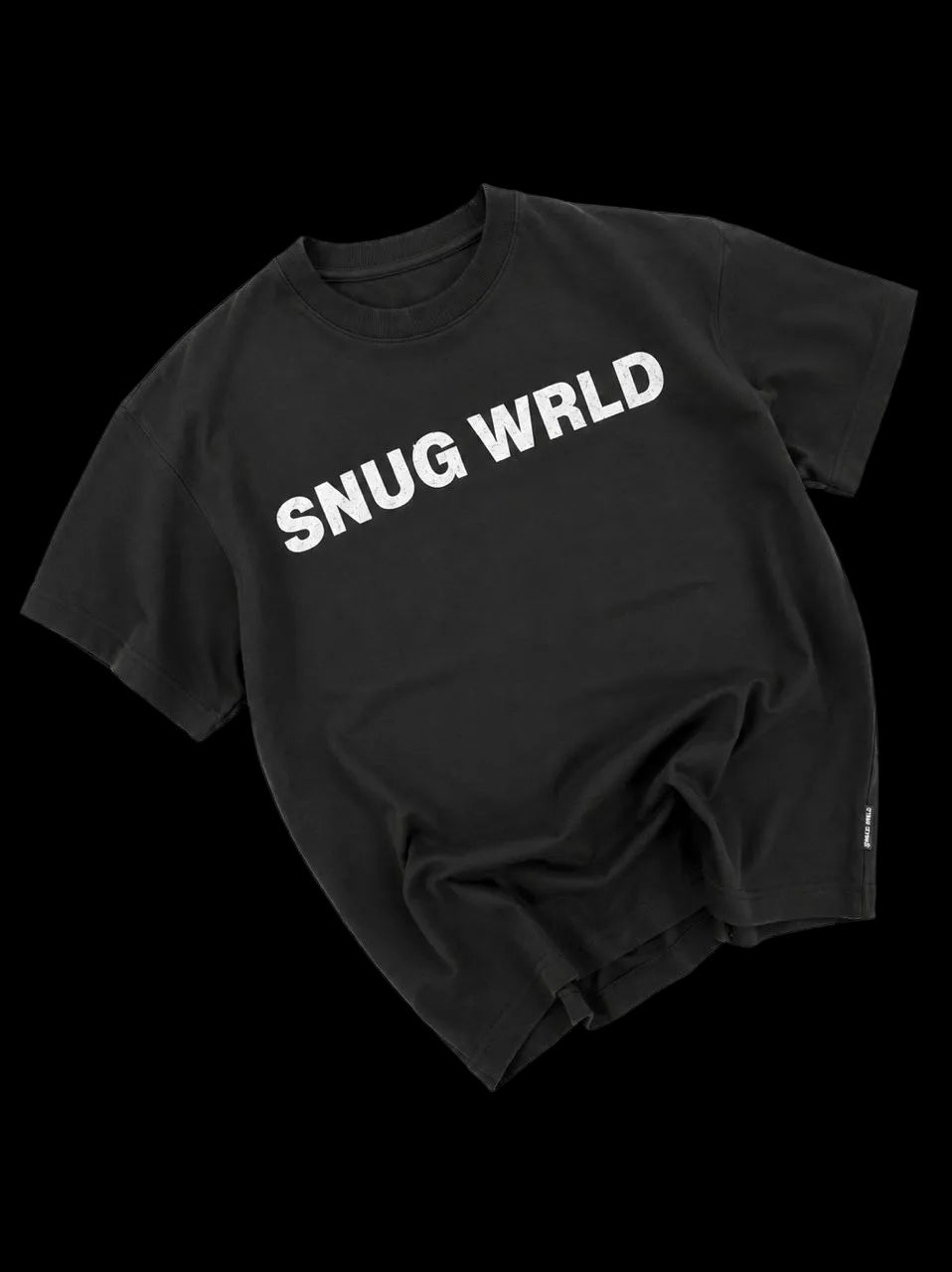 Black t-shirt with 'SNUG WRLD' text on a white background