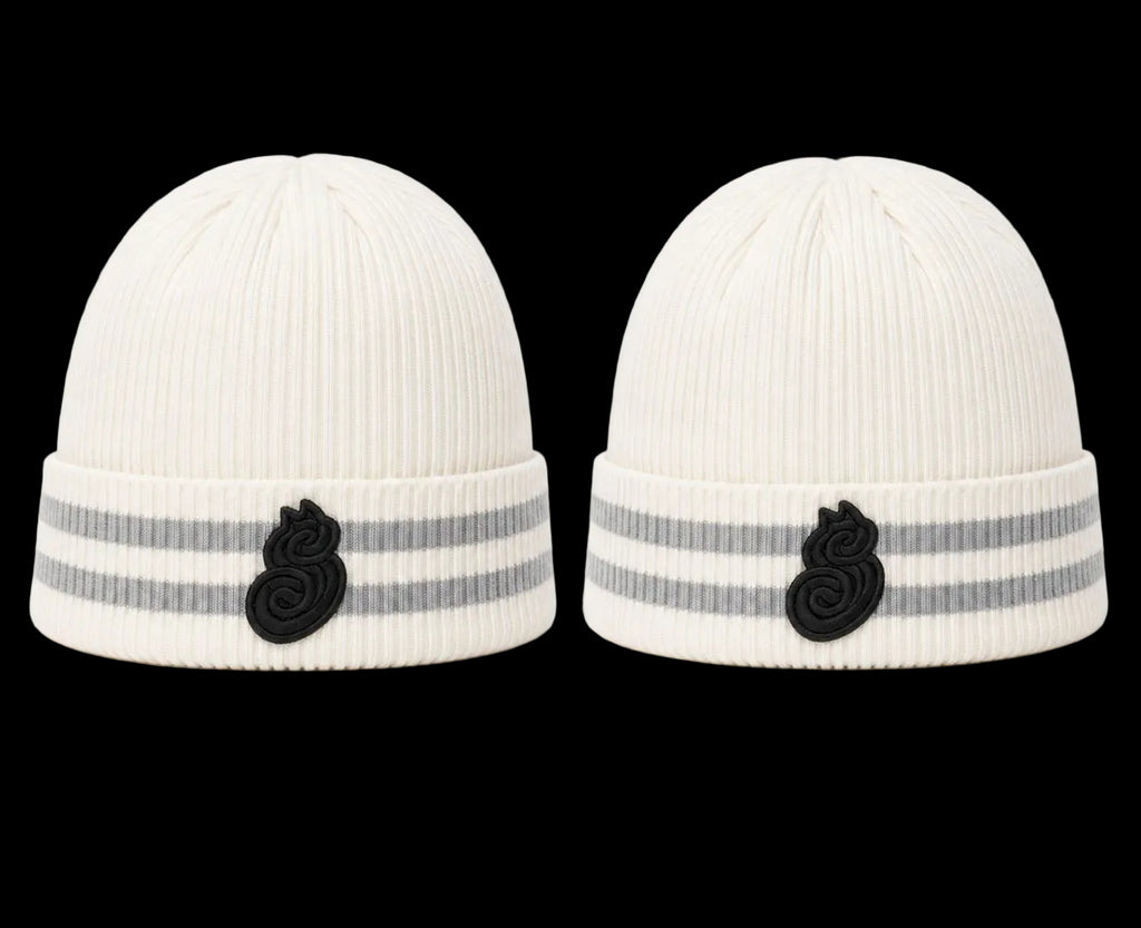 Two white knit hats with black and gray accents on a white background