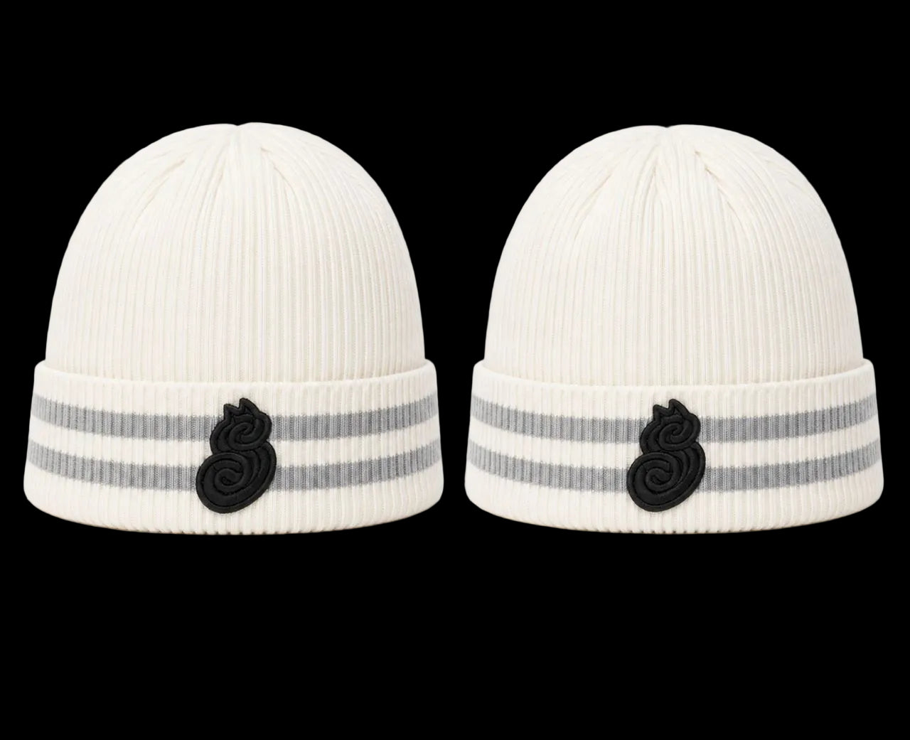 Two white knit hats with black and gray accents on a white background